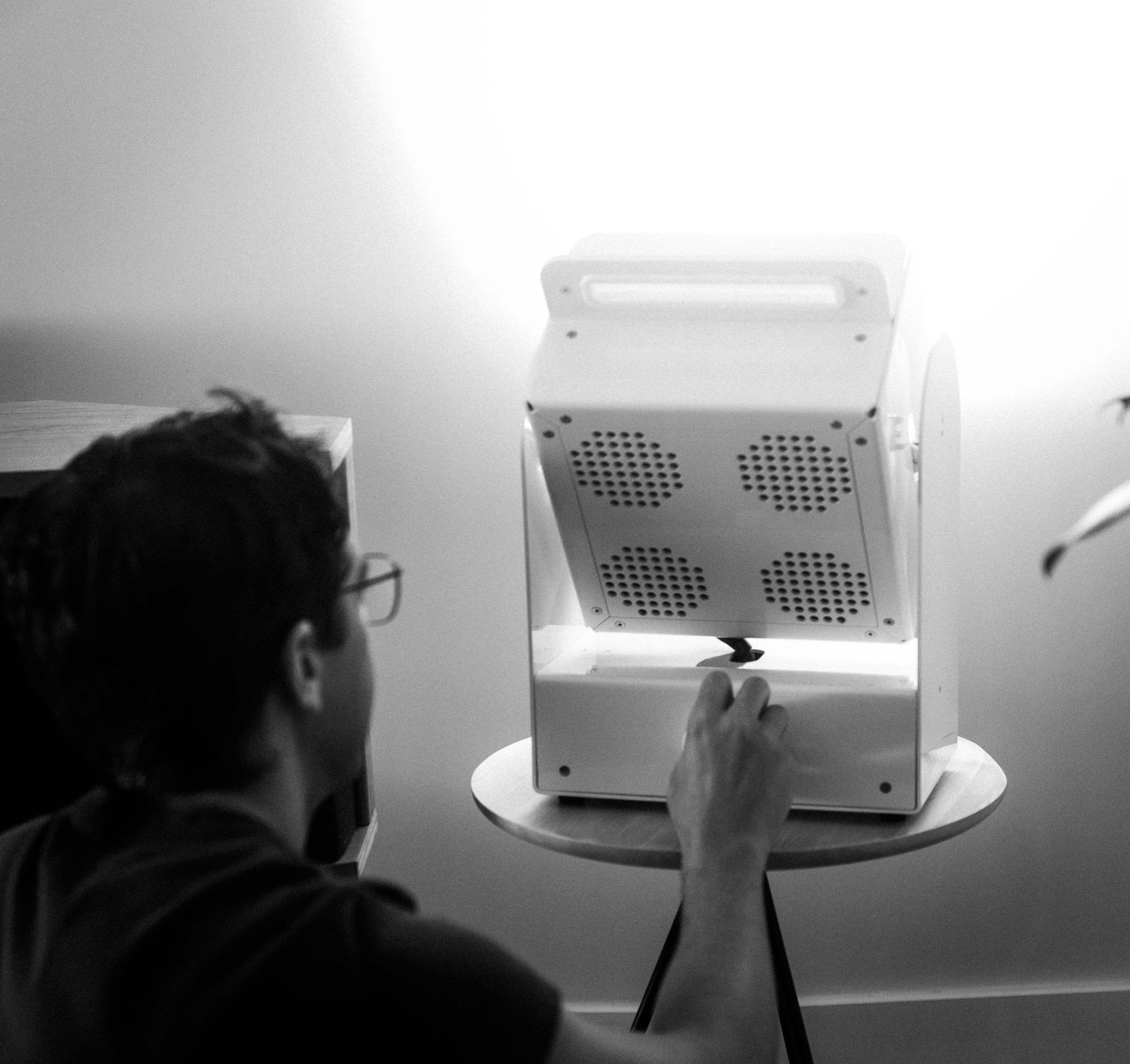 A Rhythm sunlight generator lighting a room — An evening indoors