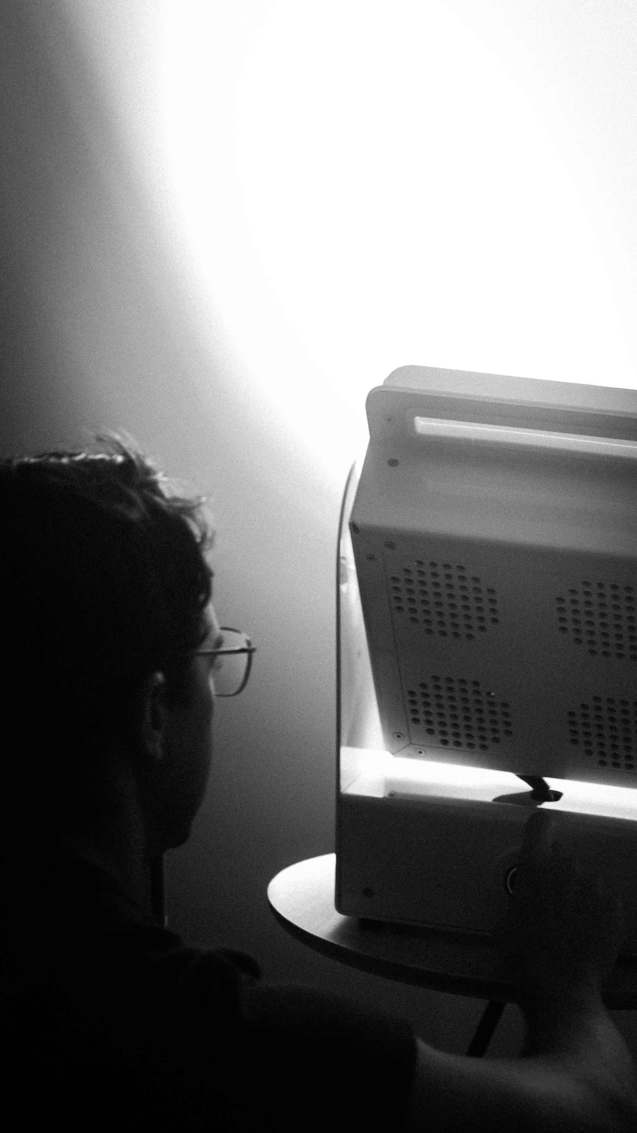 A Rhythm sunlight generator lighting a room — An evening indoors