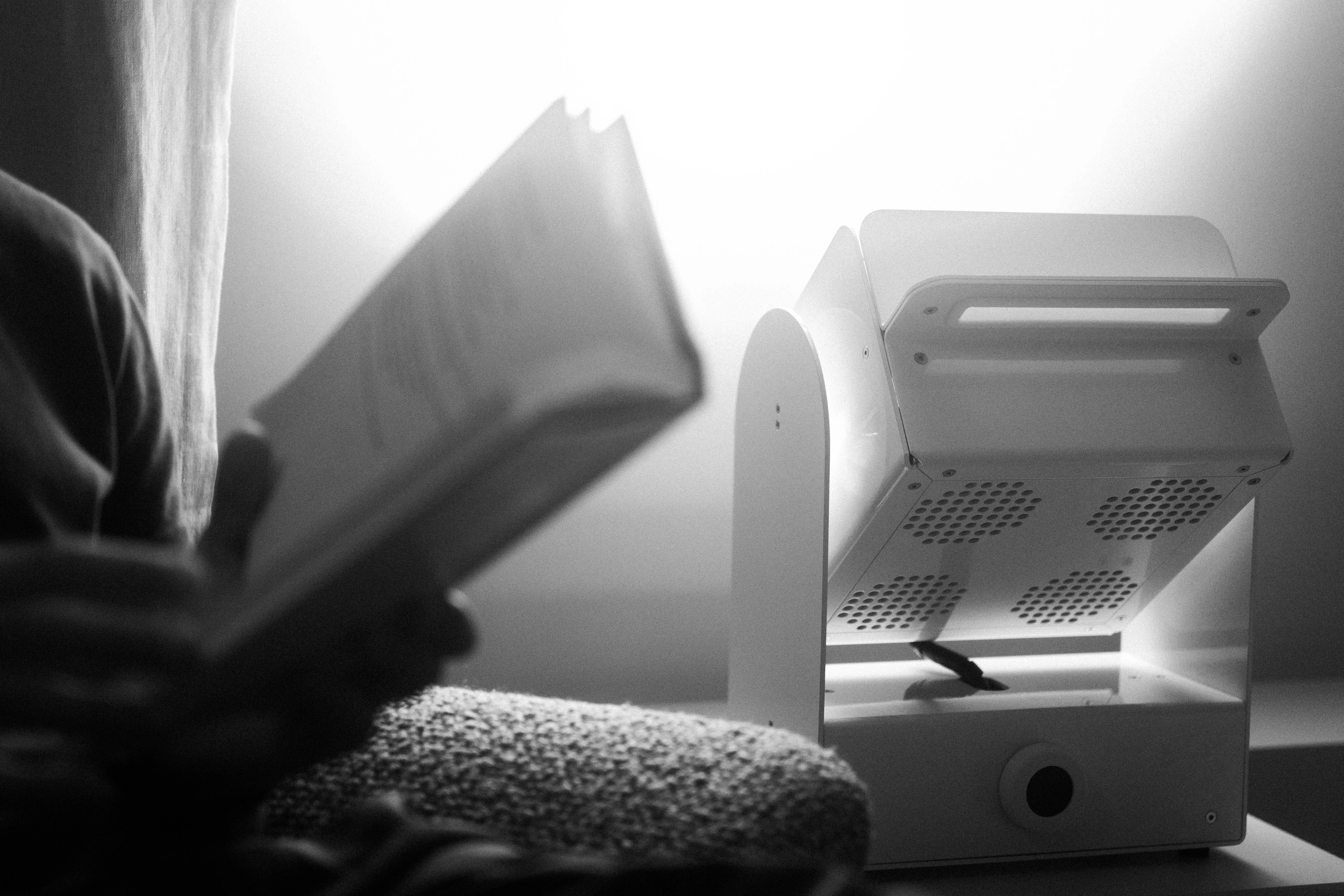 A Rhythm sunlight generator lighting a room — An evening indoors
