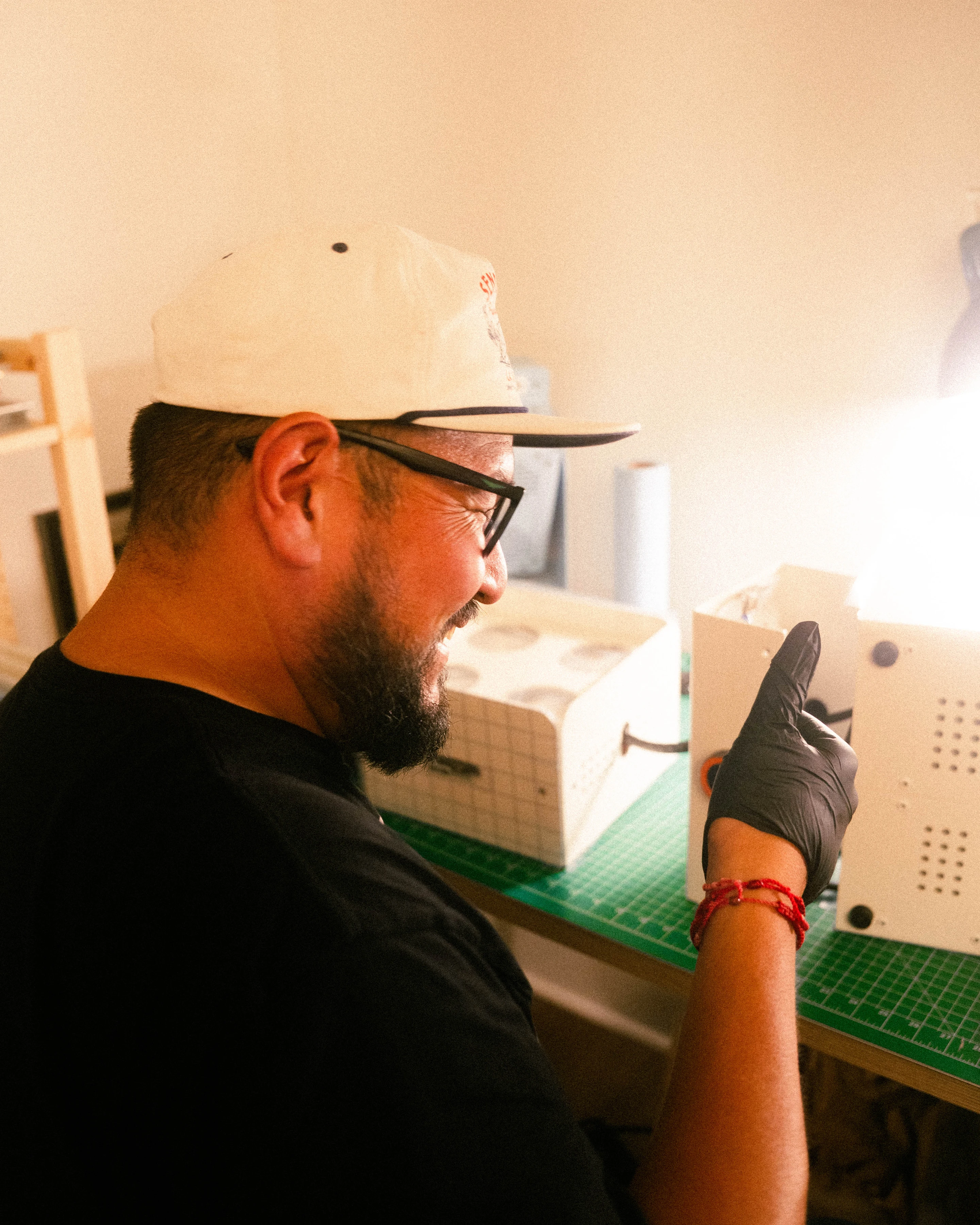 Gary at the bench, fitting a panel to a housing