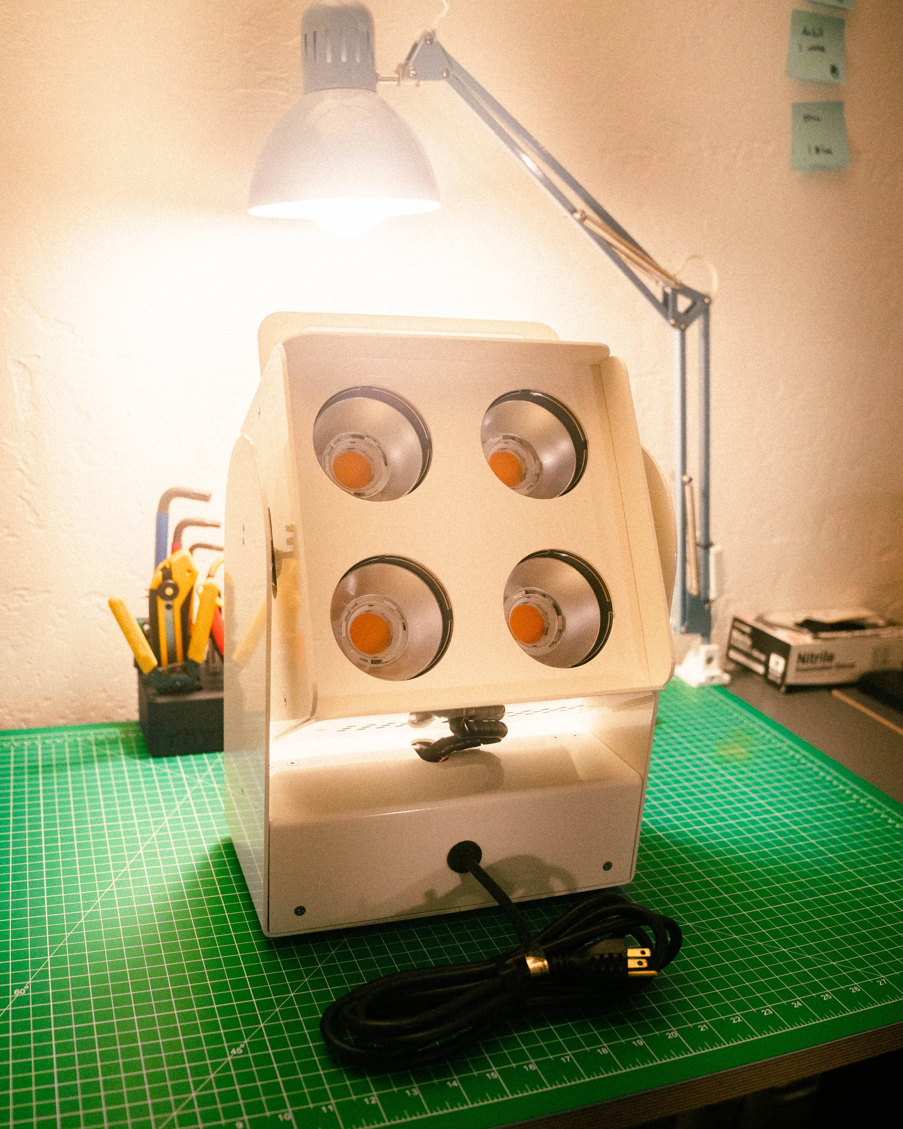 A light engine on the cutting mat under a bench lamp