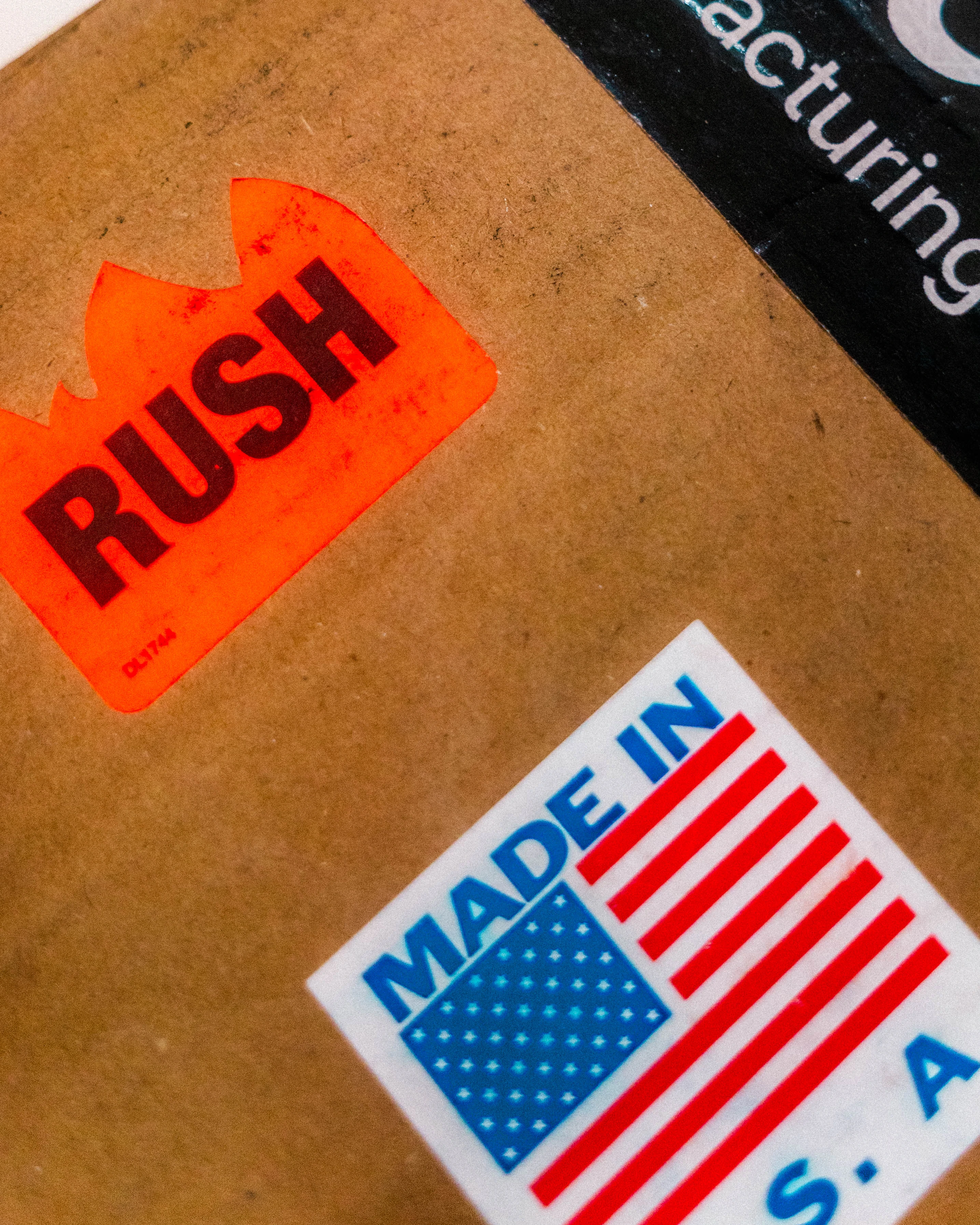 A shipping carton stencilled RUSH and MADE IN U.S.A.